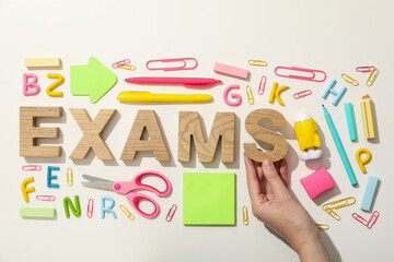 Exam, inscription on the table, on a light background.