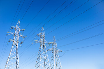High voltage tower against the sky. Power transmission tower with wires