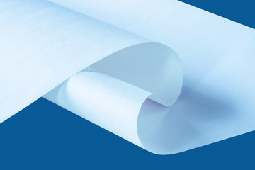 
Curved sheet of paper on a blue background.