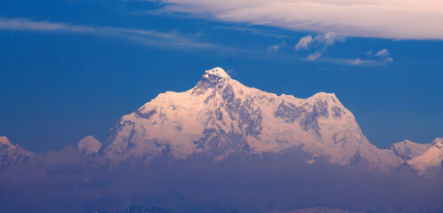 Kanchenjunga range mountain in Himalaya against blue sky