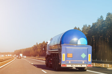 Automotive fuel tankers shipping fuel. Isothermal Tank truck driving on a highway.