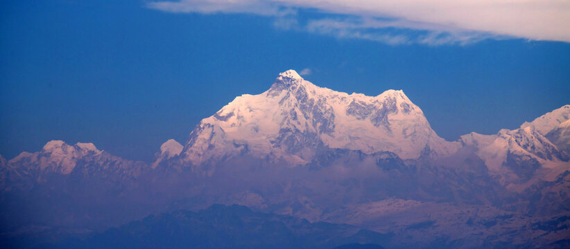 Kanchenjunga range mountain in Himalaya against blue sky
