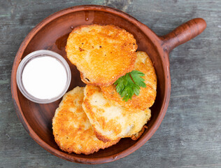 Potato pancakes with sour cream closeup. Belorussian cuisine