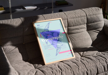 Mockup of vertical customizable poster frame on couch - obrazy, fototapety, plakaty
