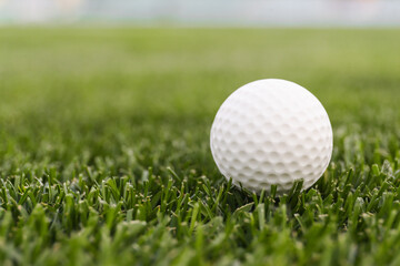 Game ball for playing golf on green grass