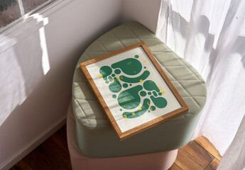 Mockup of vertical customizable poster frame on stool - obrazy, fototapety, plakaty