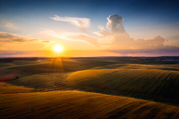 Scenic view of fields and agricultural areas at sunset. - 785090217