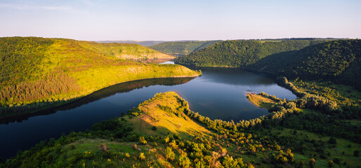 A peaceful view from above of the winding Dniester river. Ukraine, Europe.