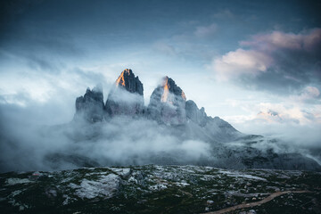 Tre Cime di Lavaredo (Drei Zinnen) under a dramatic sky. Sexten Dolomiti, South Tyrol, Europe. - obrazy, fototapety, plakaty