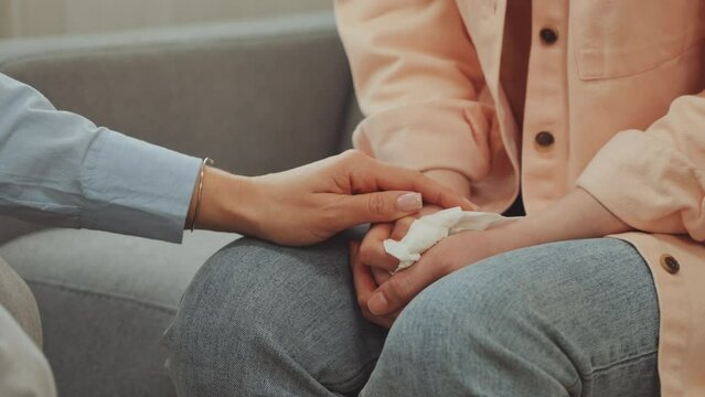Closeup therapist hand offering comfort to client, symbolizing empathy and understanding during counseling session. Emotional support and care during difficult conversation or situation