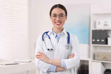 Medical consultant with glasses and stethoscope in clinic