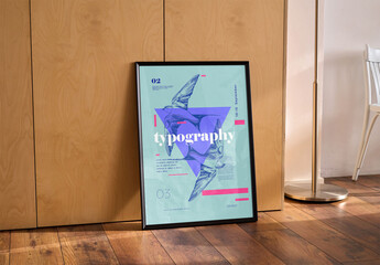 Mockup of vertical customizable black poster frame leaning by wall - obrazy, fototapety, plakaty