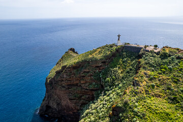 Jesus Christ Statue of Christ the King in Garajau (Cristo Rei ) near Funchal. Aerial drone view - 785093849