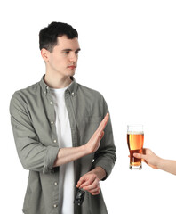 Man with car keys refusing alcohol while woman suggesting him beer on white background, closeup....