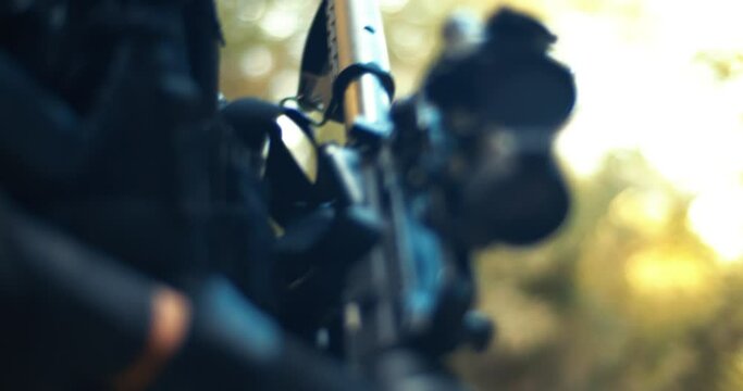 Armed Guard Patrolling with Military Equipment in Close-up