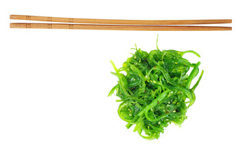 Wakame seaweed and chopsticks isolated on white background.Top view