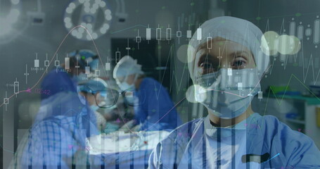 Image of data processing over surgeons in operating theatre