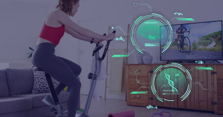 Image of data processing over caucasian woman exercising, using stationary bike at home
