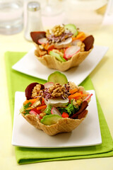 Salad pastries baskets with cheese.