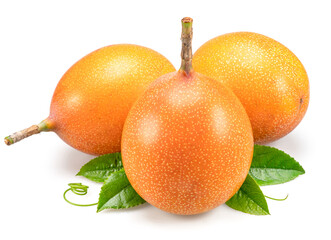 Granadilla fruits with leaves close up. The sweetest passiflora fruit or passionfruit.