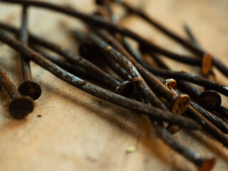 Rusty old nails on wooden background 