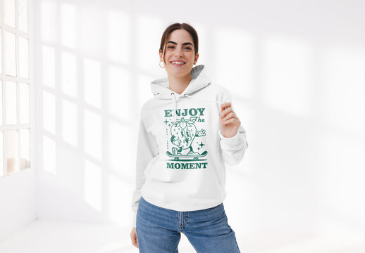 Mockup of woman in studio wearing customizable hoodie