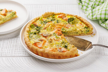 Homemade pie with salmon and broccoli