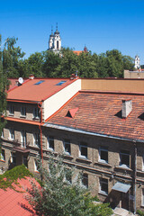 Red tiled roofs of houses and churches in the back. Architecture of the old European town