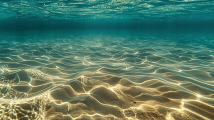 Sand ripples, underwater view, close-up, high-angle, ocean floor patterns, clear water