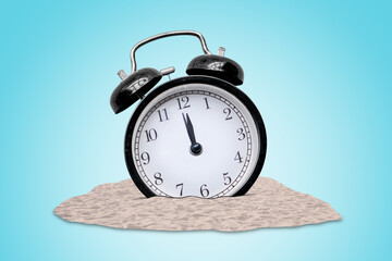 Collage image of an alarm clock on a sand dune beach