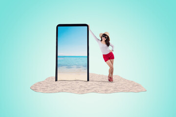 Asian woman in summer vacation trip standing next to a big 3d model of phone