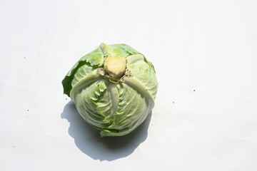 Cabbage vegetable white background. It is a leafy green, red, or white  biennial plant grown as an...