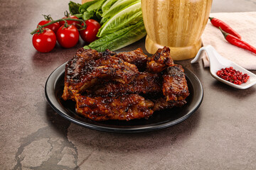 Grilled pork ribs in barbecue sauce