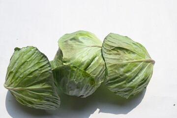 Cabbage vegetable white background. It is a leafy green, red, or white  biennial plant grown as an...