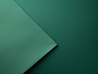 Green background with dark green paper on the right side, minimalistic background, copy space concept, top view, flat lay
