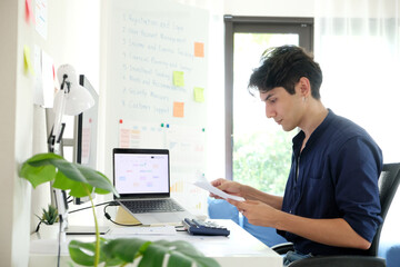 Man working with computer at home office, Working at home, Online learning education