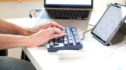 Closeup of man hand typing keyboard computer at home office - 785120628