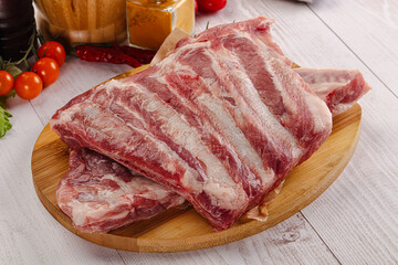 Raw pork ribs over board