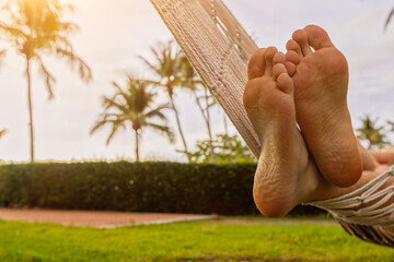 relaxation, feet in beach hammock closeup, rest