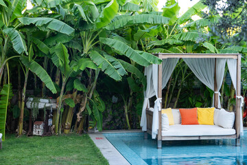 Relaxation Area Inside the Pool Surrounded by Tropical Trees Photo, Alacati Cesme, Izmir Turkiye (Turkey)