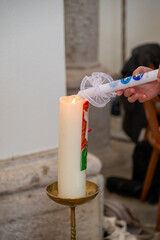 igniting of babtism candle on the easter candle