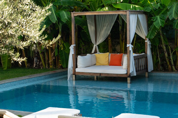 Relaxation Area Inside the Pool Surrounded by Tropical Trees Photo, Alacati Cesme, Izmir Turkiye (Turkey)
