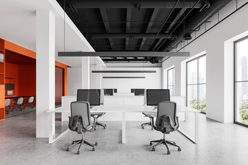 Modern office interior with meeting table and coworking zone, panoramic window