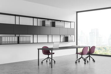 Modern office interior with work table and chairs near panoramic window