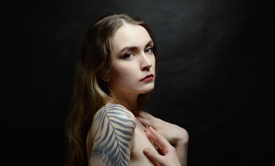 Portrait of beautiful sensual woman with tattoos, close-up. Studio shot. - 785129086