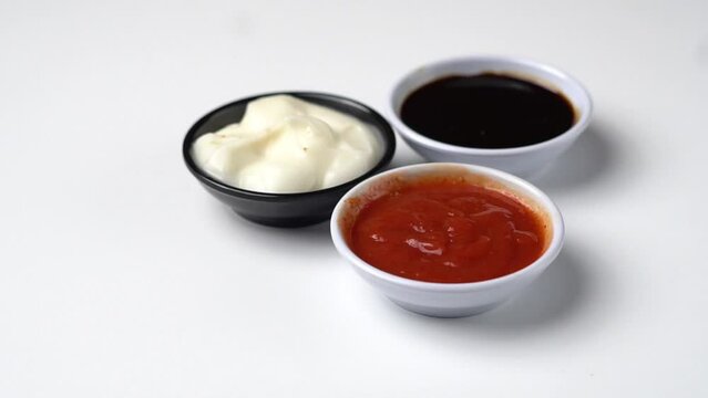 Close up of fried tofu and chili sauce on white background