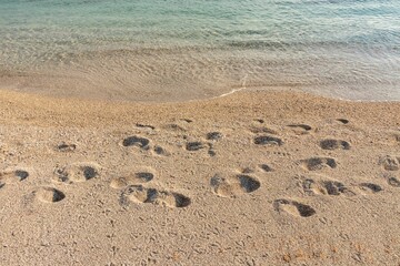 Beautiful shot of the sandy beach and the waves