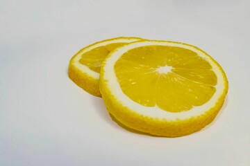 Closeup of lemon slice on white background
