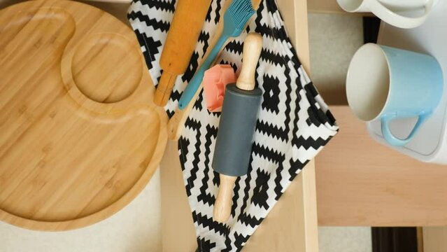 Modern kitchen wooden shelf and kitchenware, vertical shooting
