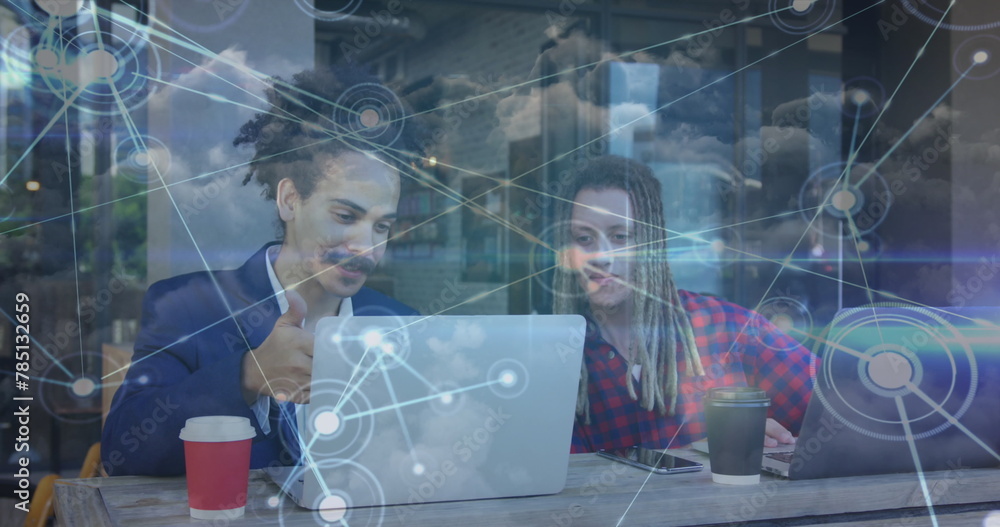 Poster image of network of connections with icons over men using laptop